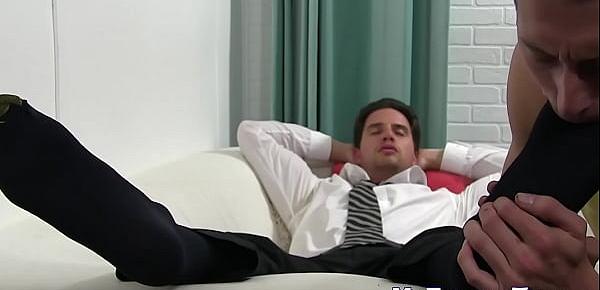  Handsome guy in a suit enjoys feet massage and toe sucking